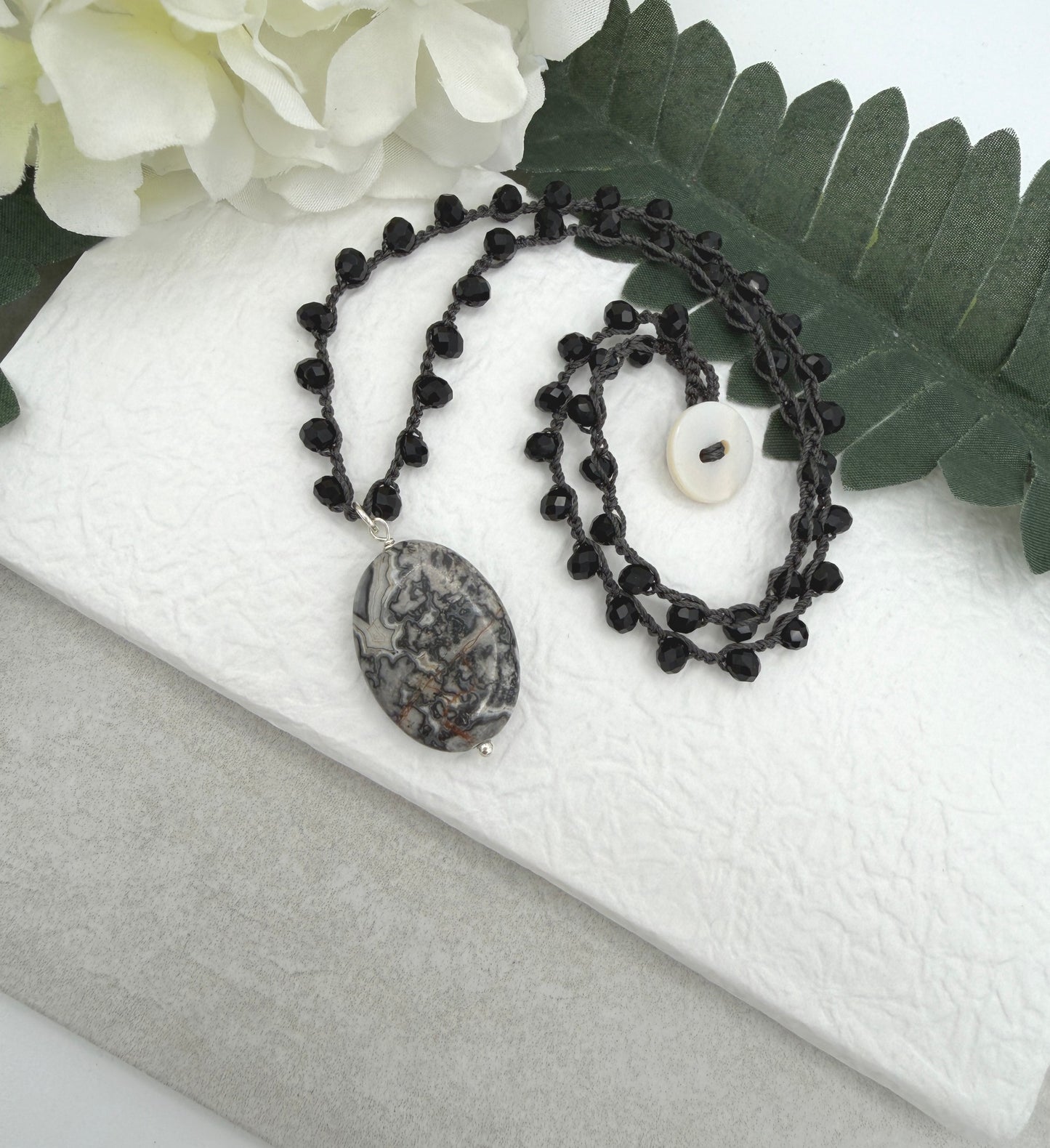Crocheted Necklace with a Dark Gray Cord, Black Crystal Beads and a Silver Leopard Jasper Pendant SN-703