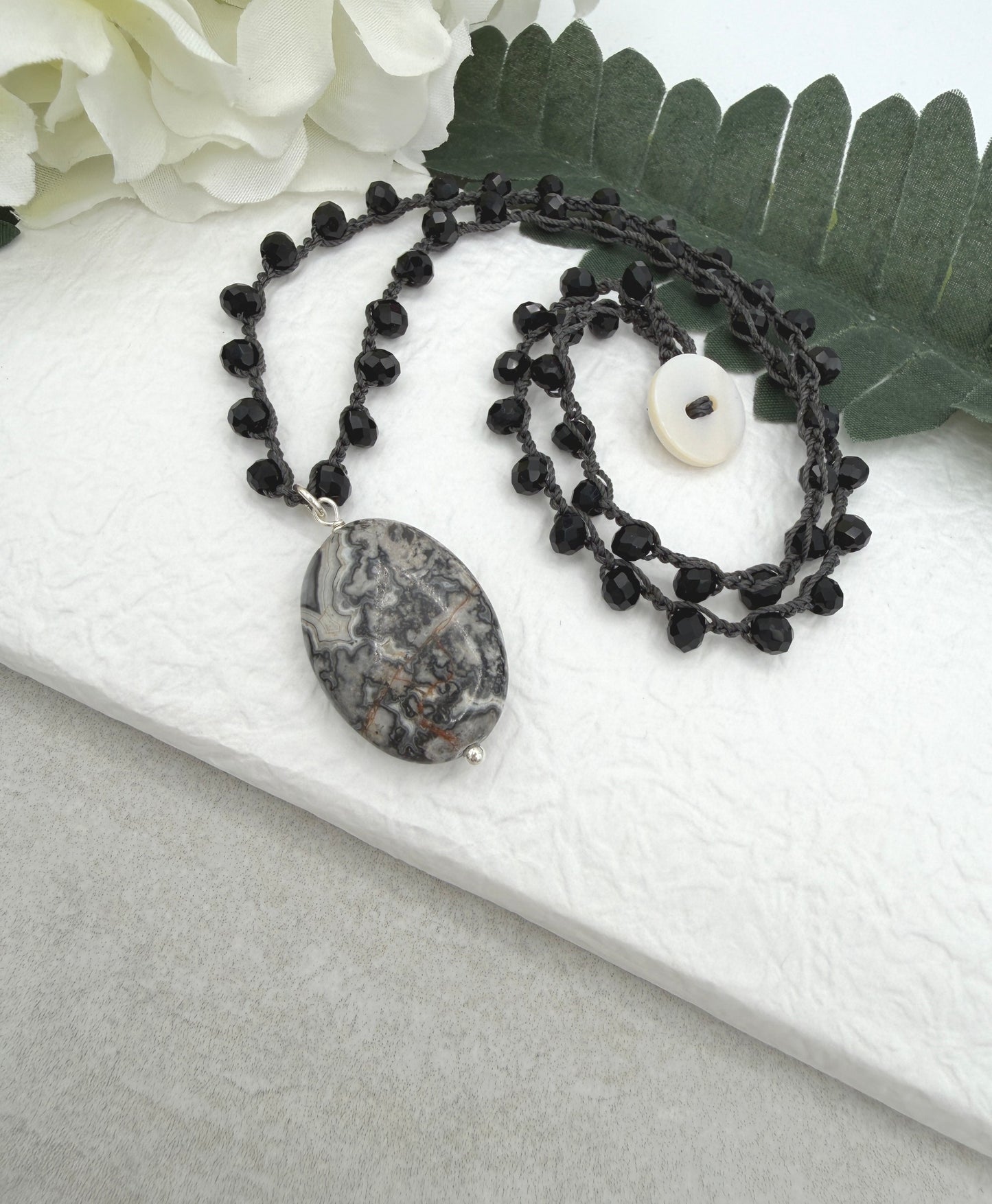 Crocheted Necklace with a Dark Gray Cord, Black Crystal Beads and a Silver Leopard Jasper Pendant SN-703
