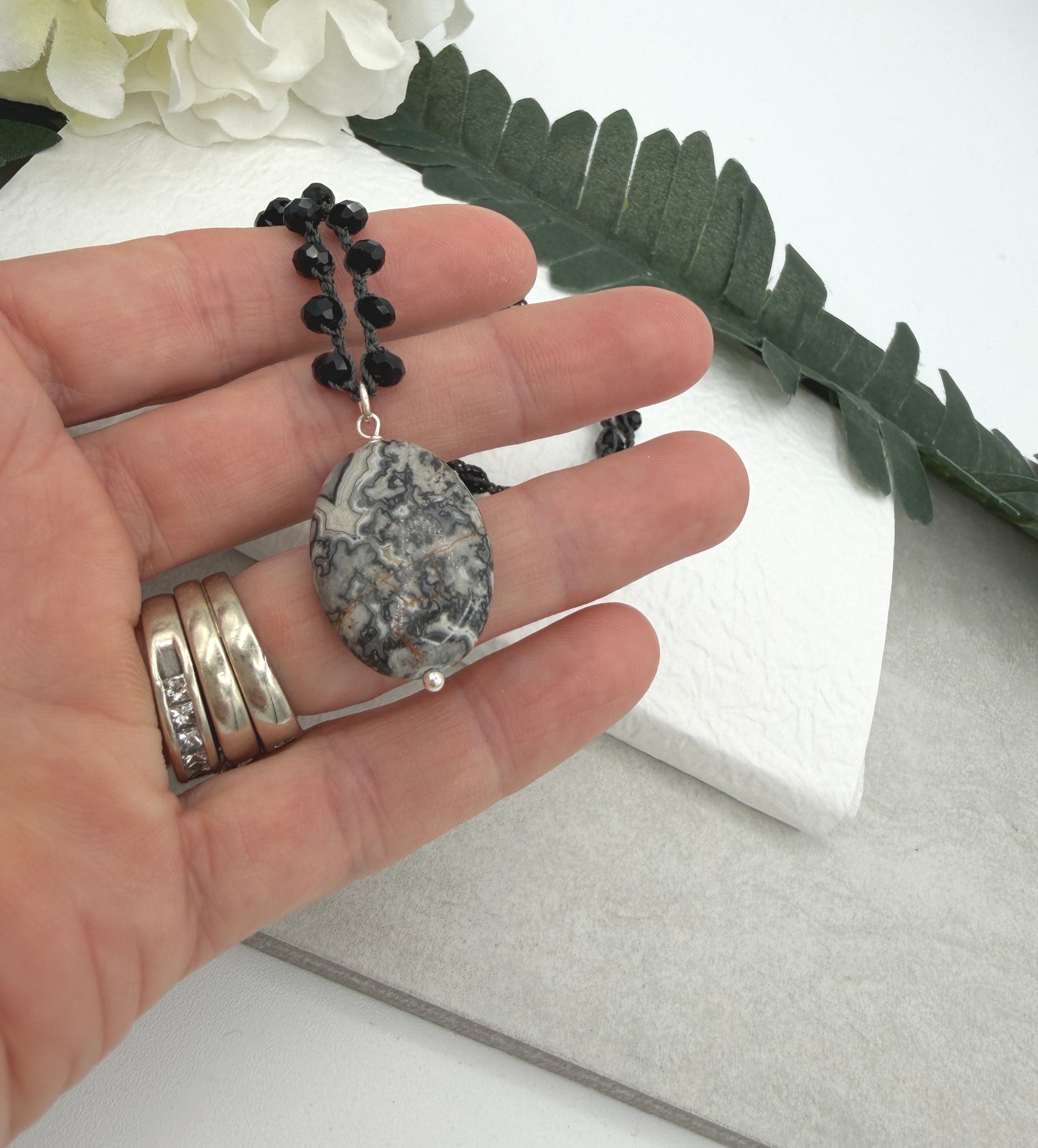 Crocheted Necklace with a Dark Gray Cord, Black Crystal Beads and a Silver Leopard Jasper Pendant SN-703