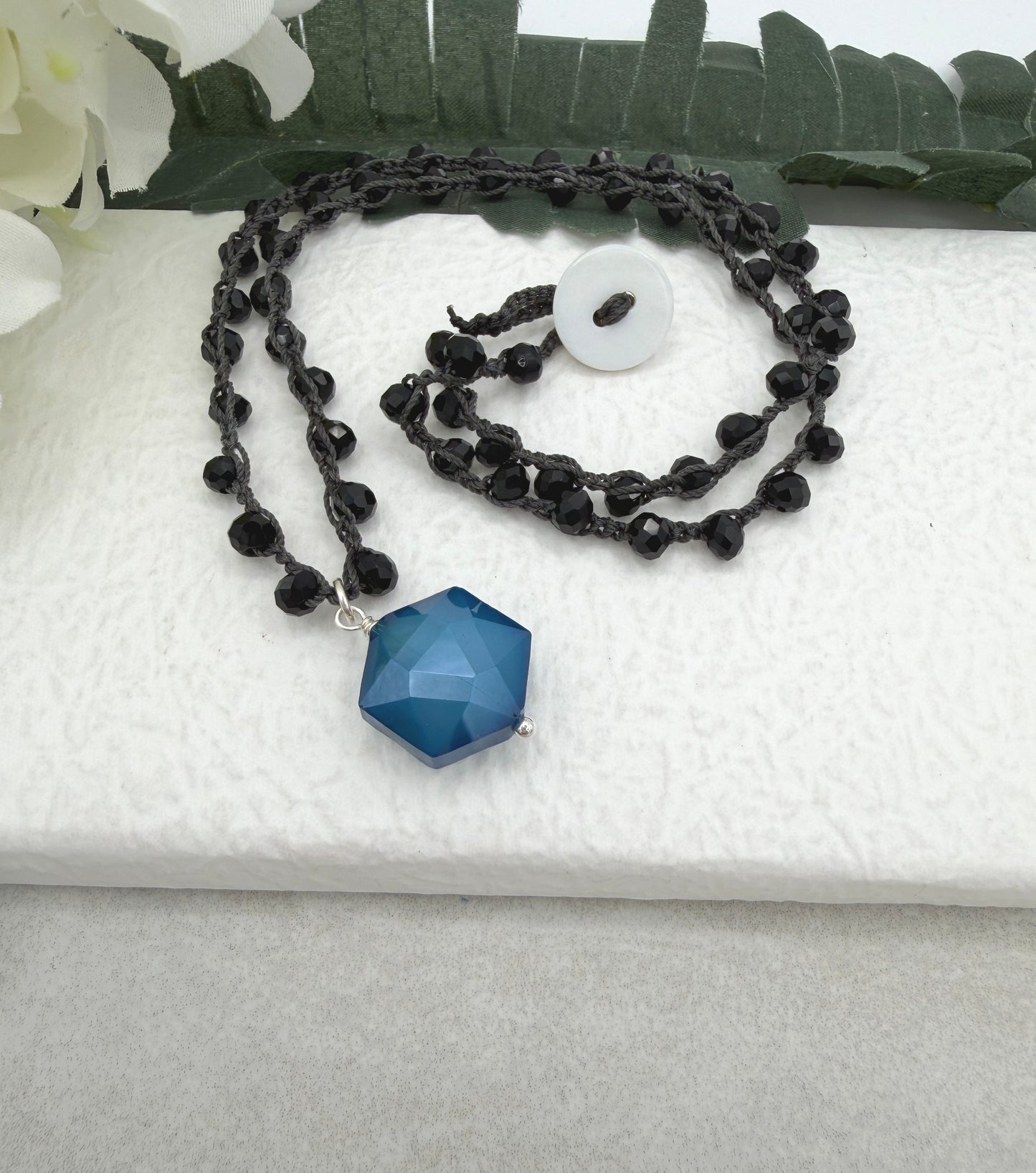 Crocheted Necklace with a Dark Gray Cord, Black Crystal Beads and a Blue Crystal Hexagon Bead Pendant SN-704