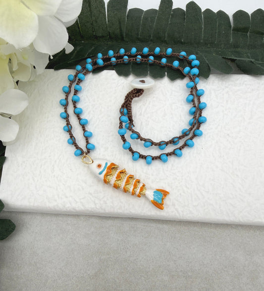 Crocheted Necklace with a Brown Cord, Turquoise Glass Beads and a White, Orangle Enameled Fish Charm SN-705