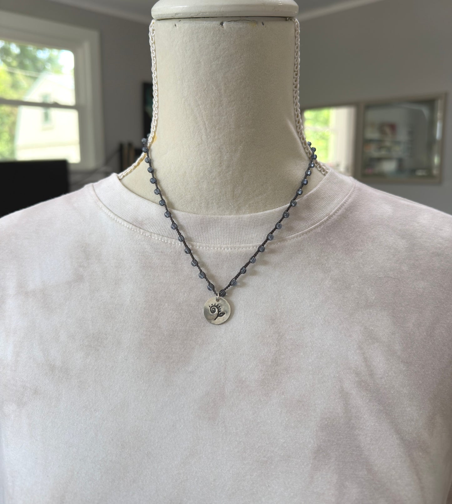 Crocheted Necklace with a Dark Gray Cord, Montana Blue Glass Beads and a Round, PMC Pendant with a Fiddle head Fern SN-707