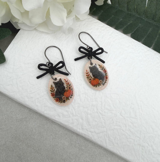 Earrings Made with Black Bow LInks and Polymer Clay Ovals with a Black Cat Design and Oxidized Silver Earring Wires PCE-1081