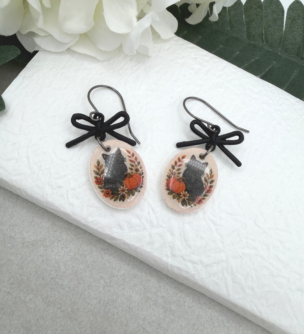 Earrings Made with Black Bow LInks and Polymer Clay Ovals with a Black Cat Design and Oxidized Silver Earring Wires PCE-1081