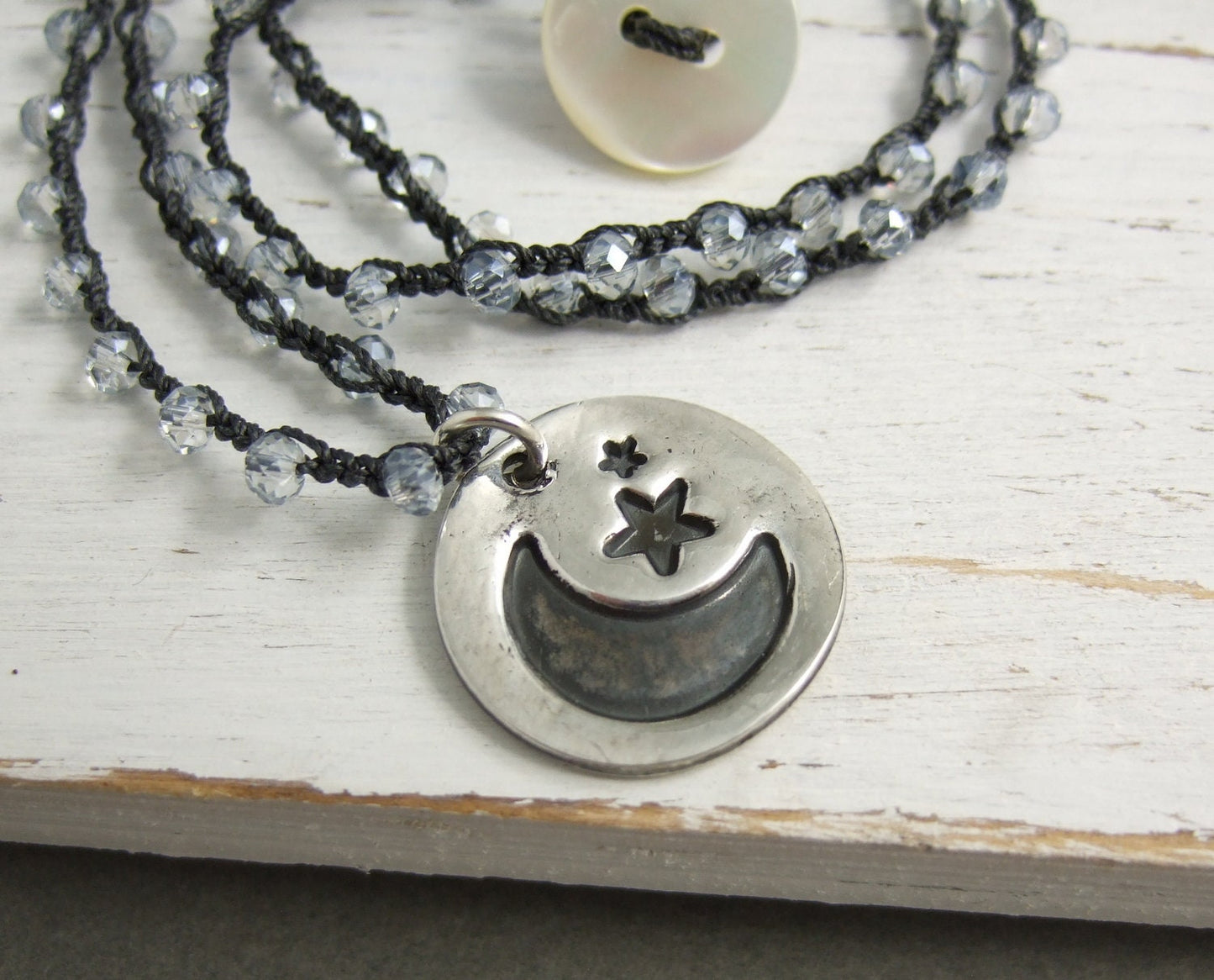 Crocheted Necklace with a Dark Gray Cord, Blue AB Crystal Beads and a Round, PMC Pendant with a Moon and Stars Design SN-427
