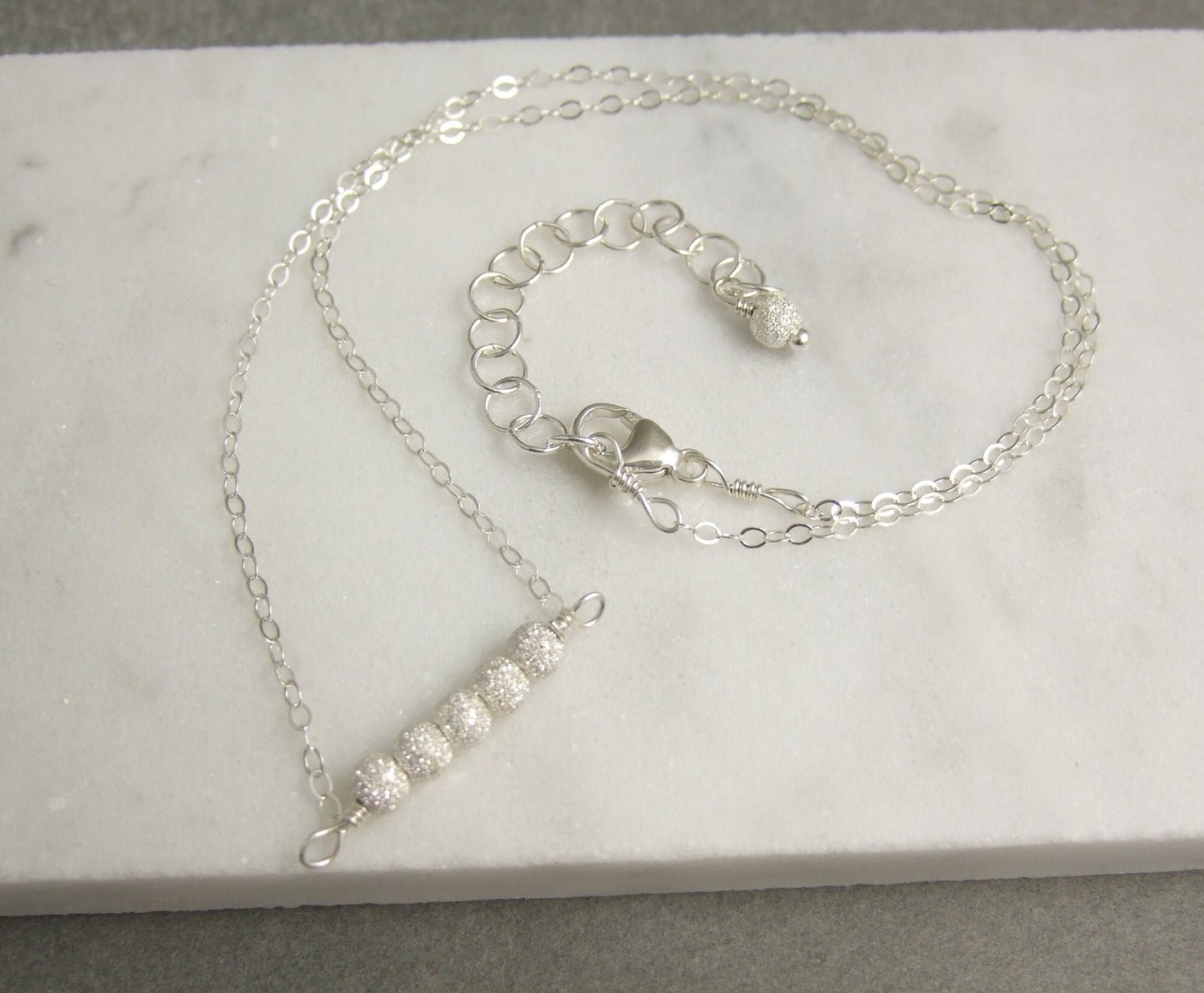 Necklace with a Line of Sterling Silver Stardust Beads, Wire Wrapped to a Sterling Silver Cable Chain CDN-792