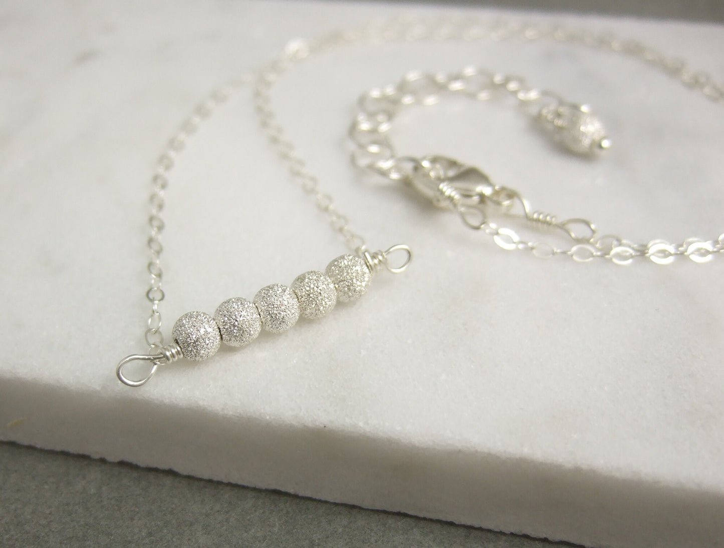 Necklace with a Line of Sterling Silver Stardust Beads, Wire Wrapped to a Sterling Silver Cable Chain CDN-792