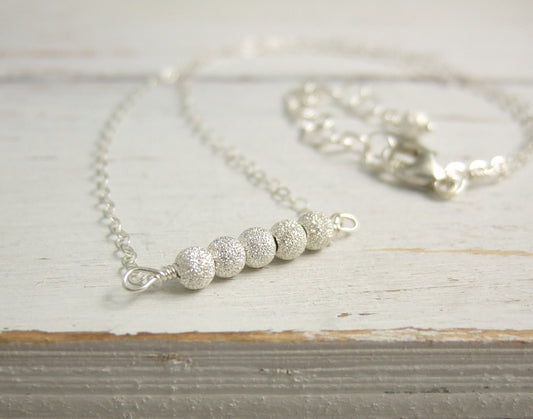 Necklace with a Line of Sterling Silver Stardust Beads, Wire Wrapped to a Sterling Silver Cable Chain CDN-792