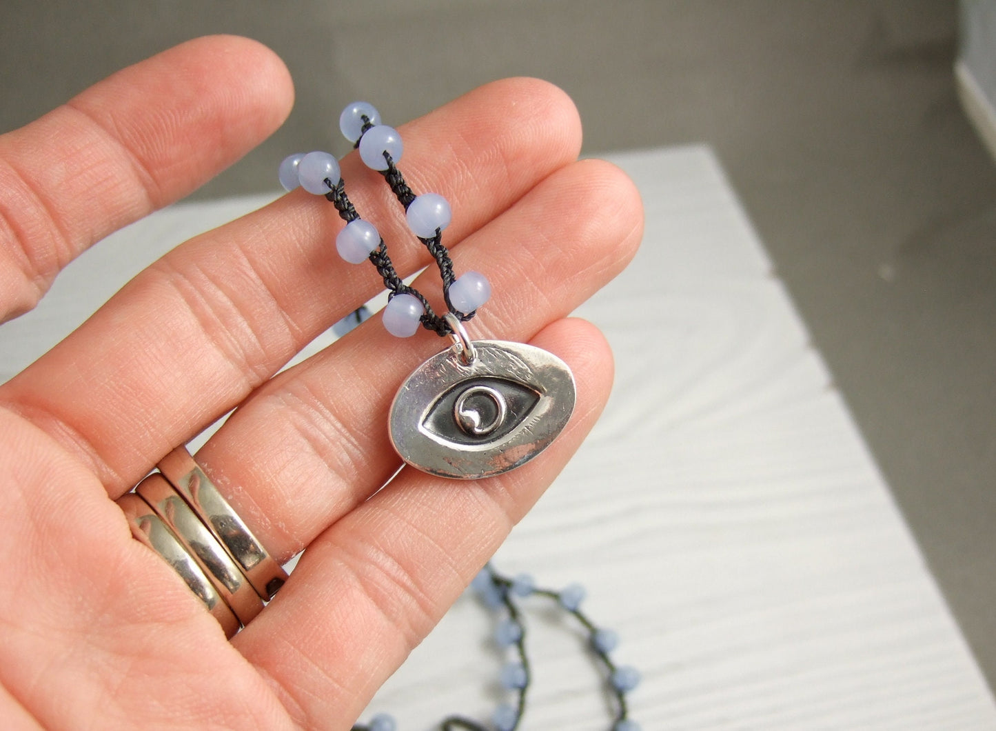 Crocheted Necklace with a Dark Gray Cord, Blue Glass Beads and an Oval, PMC Pendant with an Eye SN-567