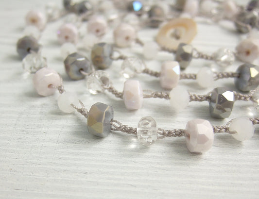 A Long, Hand Crocheted Necklace with a Gray Cord, White, Clear, Gray and Pink Crystal Beads SN-577