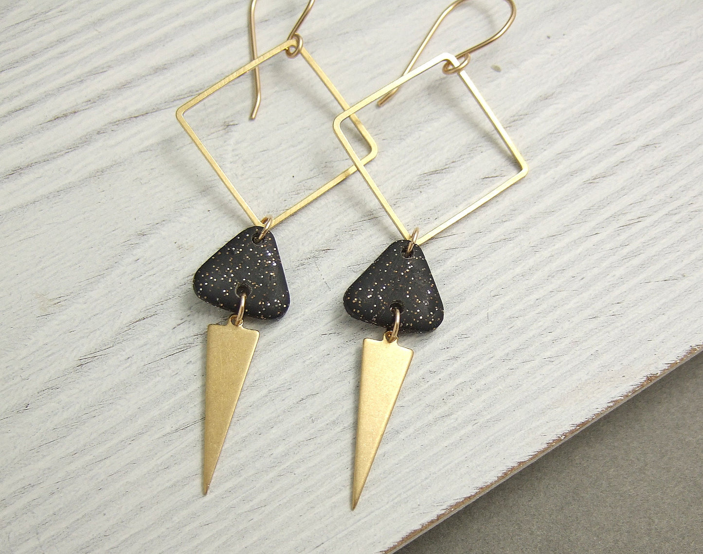 Earrings made with Triangles of Sparkly, Black Polymer Clay, Brass Triangles and Brass Squares on 14k Gold Filled Earring Wires PCE-59