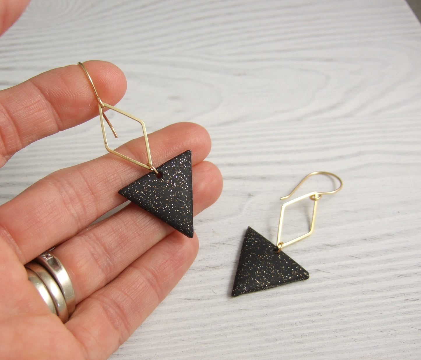 Earrings made with Triangles of Sparkly, Black Polymer Clay and Brass Diamonds on 14k Gold Filled Earring Wires PCE-84