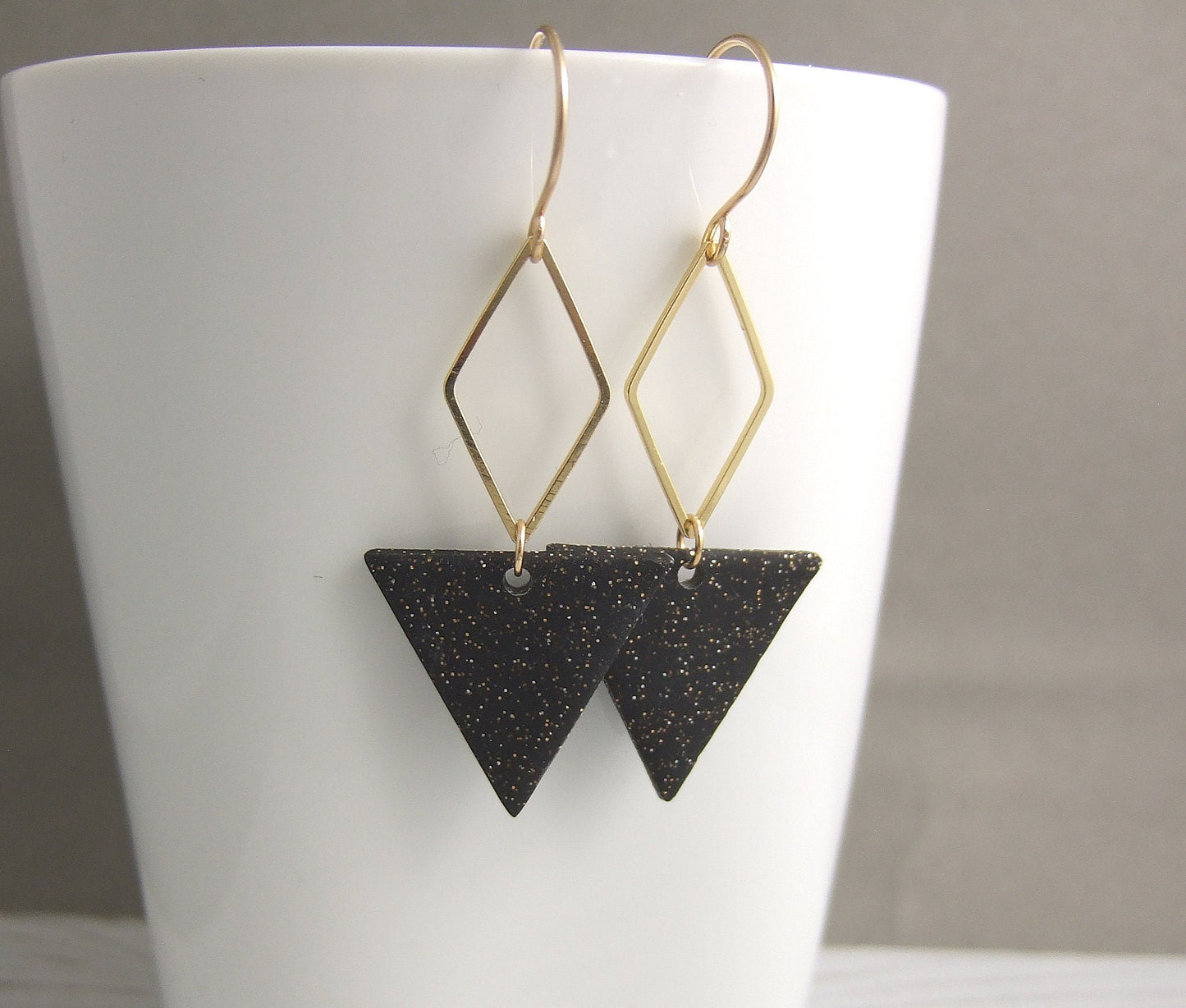 Earrings made with Triangles of Sparkly, Black Polymer Clay and Brass Diamonds on 14k Gold Filled Earring Wires PCE-84