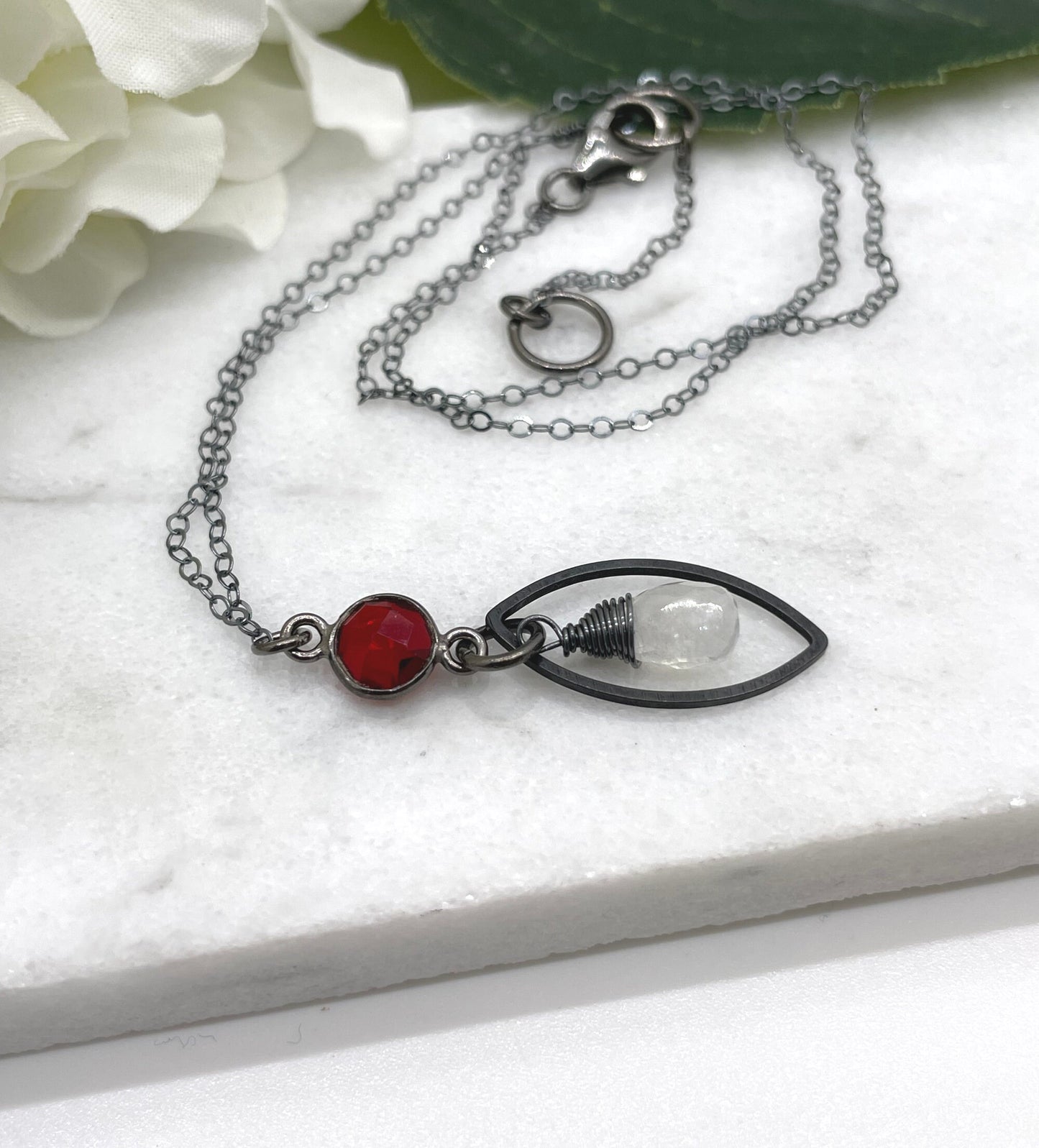 Necklace with an Oxidized Brass Loop, Bezel Set Garnet and Wire Wrapped Moonstone on an Oxidized, Sterling Silver Cable Chain CDN-861