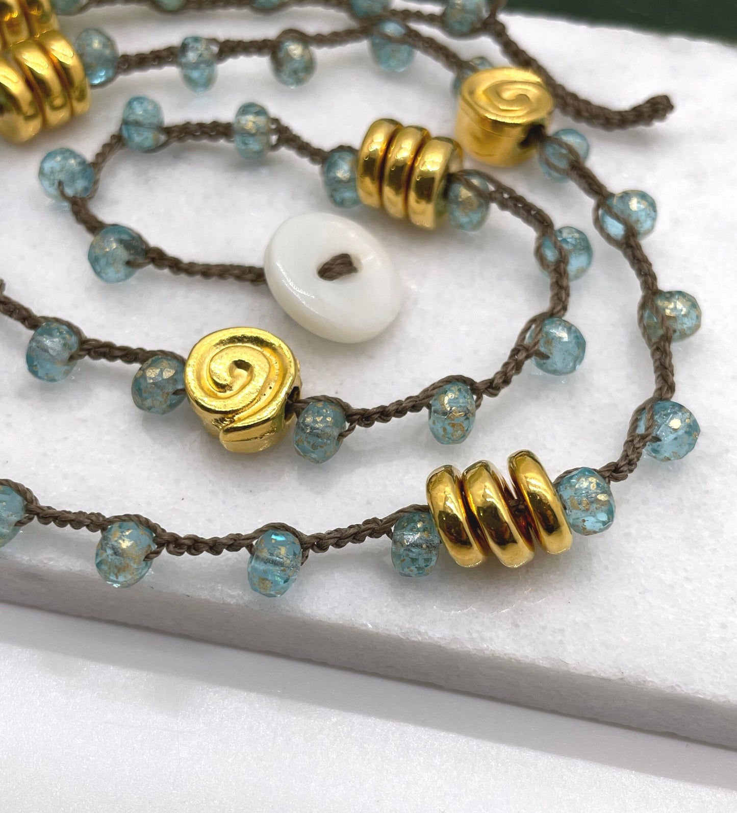 Crocheted Necklace 19 Inches with a Brown Cord, Aqua and Gold Czech Glass Beads and Gold Coated Mykonos Beads SN-607