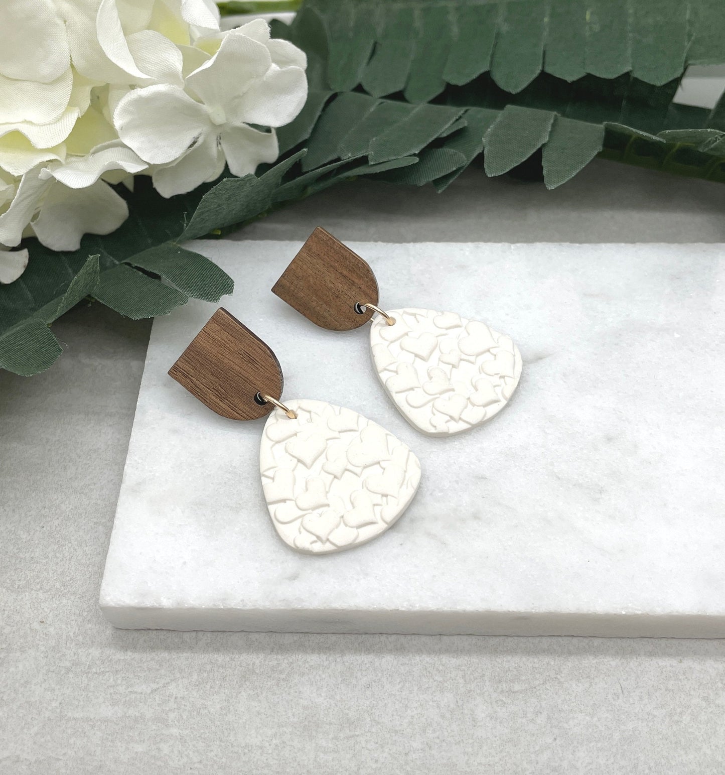 Earrings made with White Polymer Clay Textured with Hearts and Wood Posts PCE-611