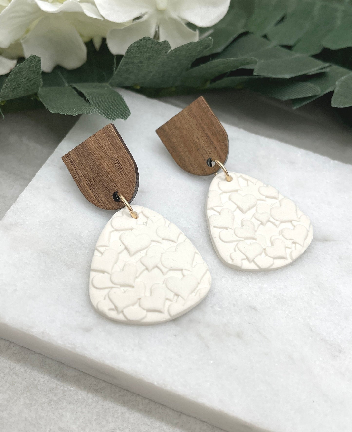Earrings made with White Polymer Clay Textured with Hearts and Wood Posts PCE-611