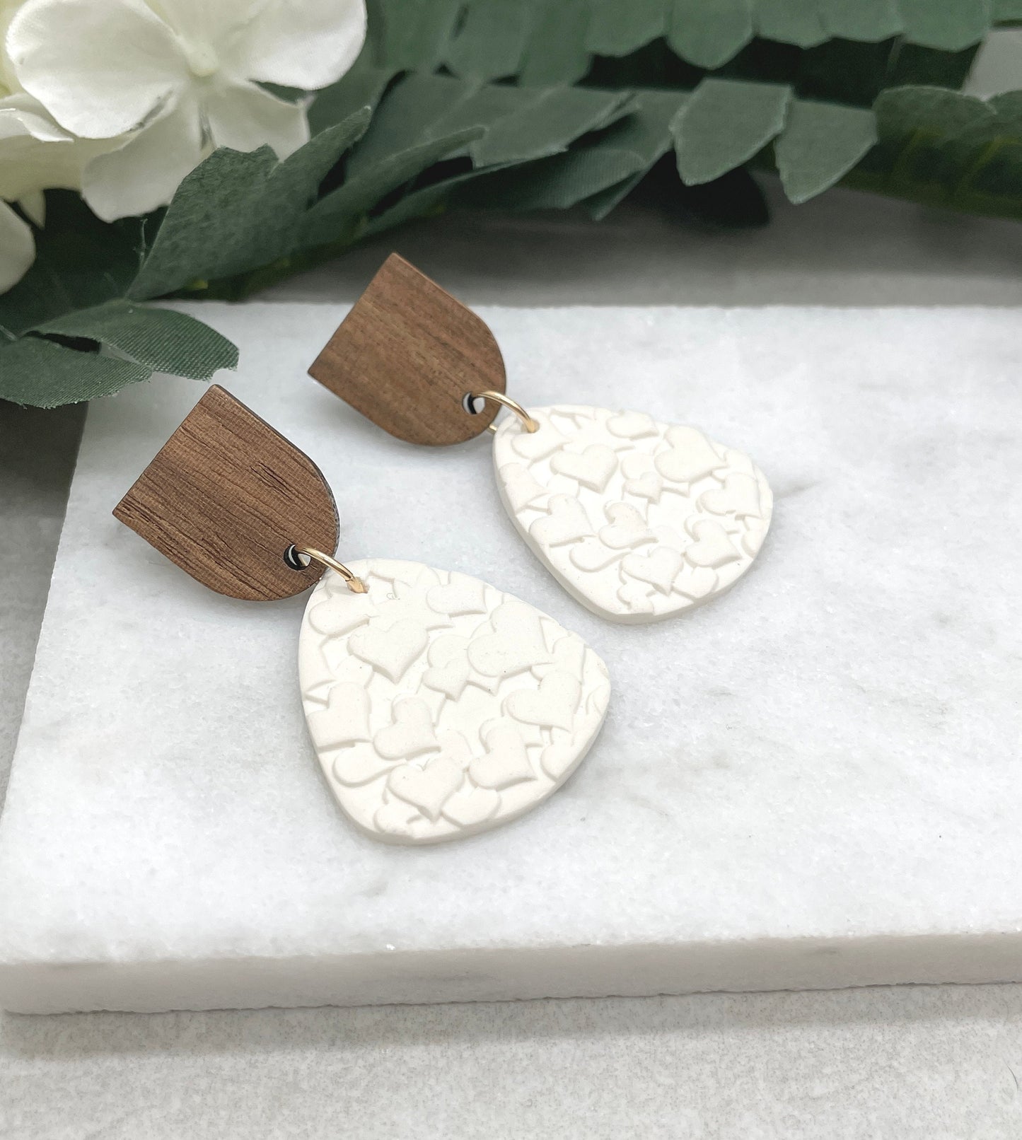 Earrings made with White Polymer Clay Textured with Hearts and Wood Posts PCE-611