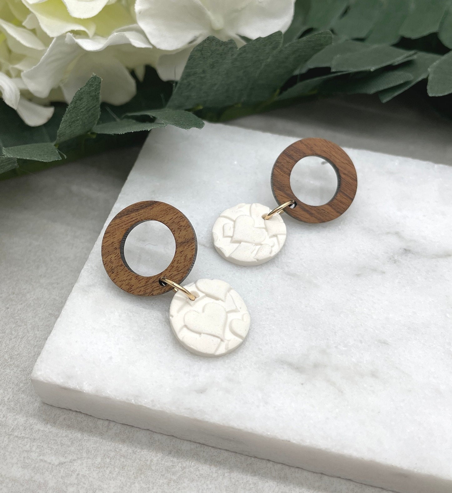Earrings made with White Polymer Clay Circles Textured with Hearts and Wood Circle Posts PCE-612