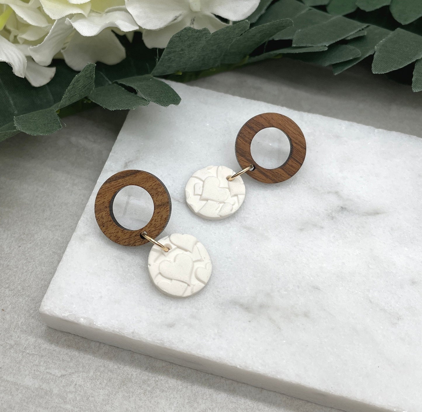 Earrings made with White Polymer Clay Circles Textured with Hearts and Wood Circle Posts PCE-612
