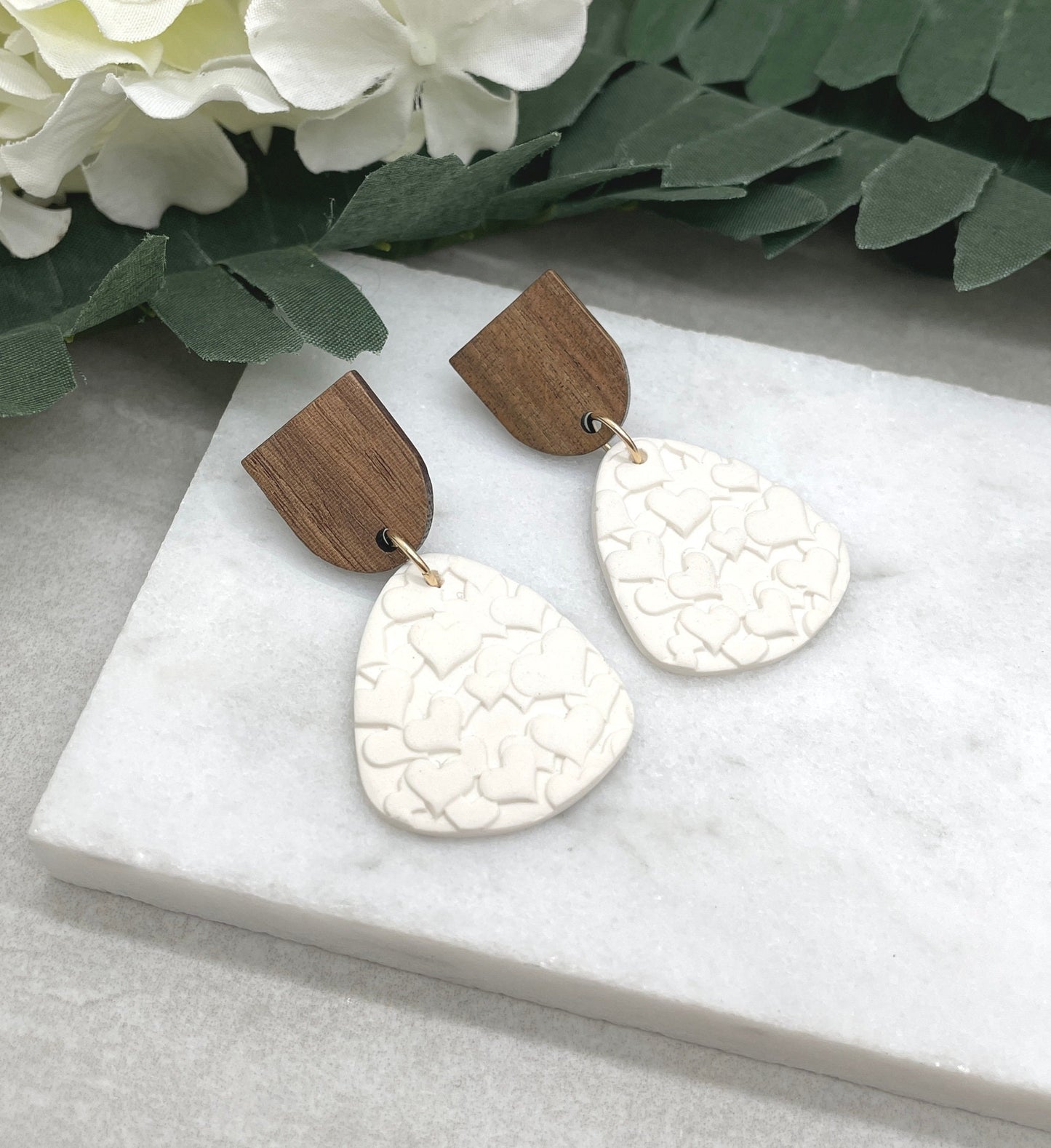 Earrings made with White Polymer Clay Textured with Hearts and Wood Posts PCE-611