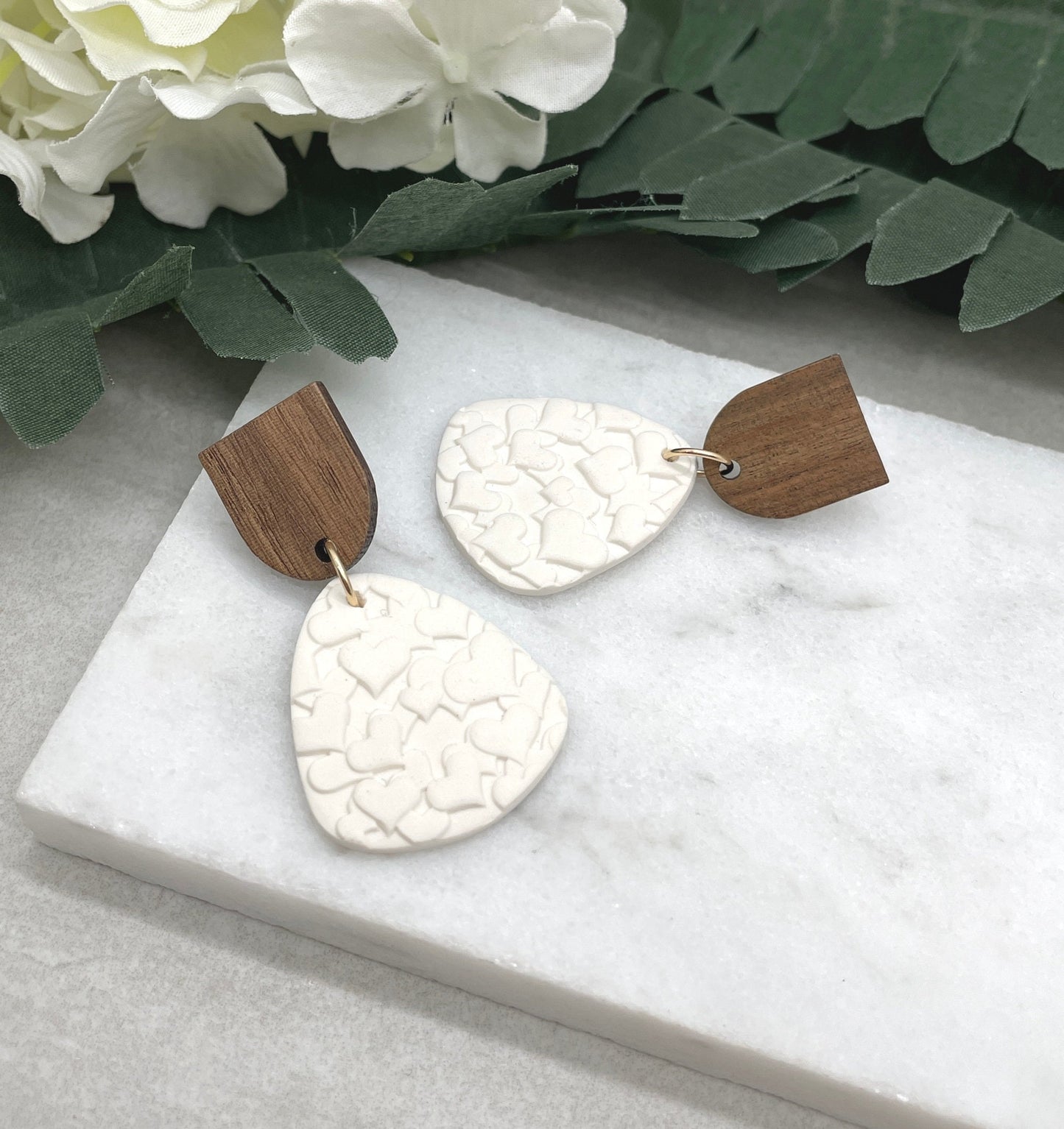 Earrings made with White Polymer Clay Textured with Hearts and Wood Posts PCE-611