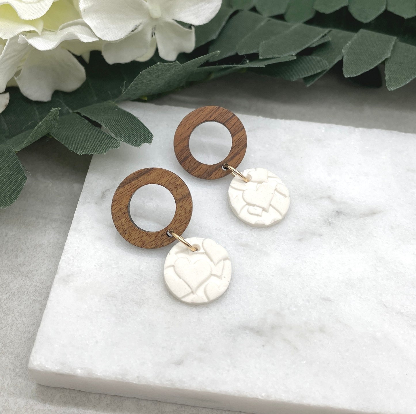 Earrings made with White Polymer Clay Circles Textured with Hearts and Wood Circle Posts PCE-612